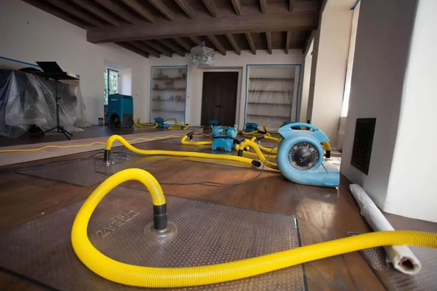 Technician extracting standing water from a Marietta, GA floor